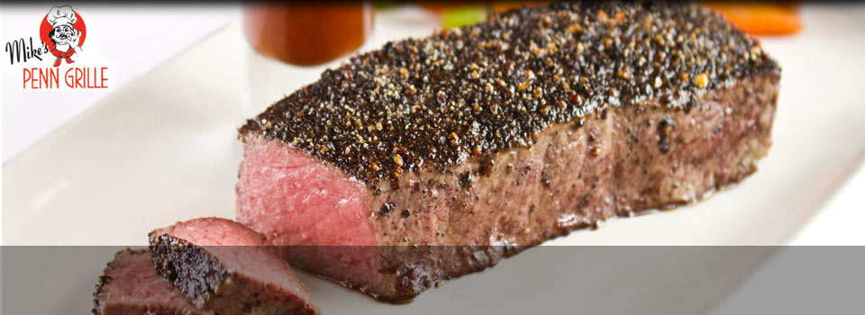 Pepper-crusted steak, sliced and served medium rare